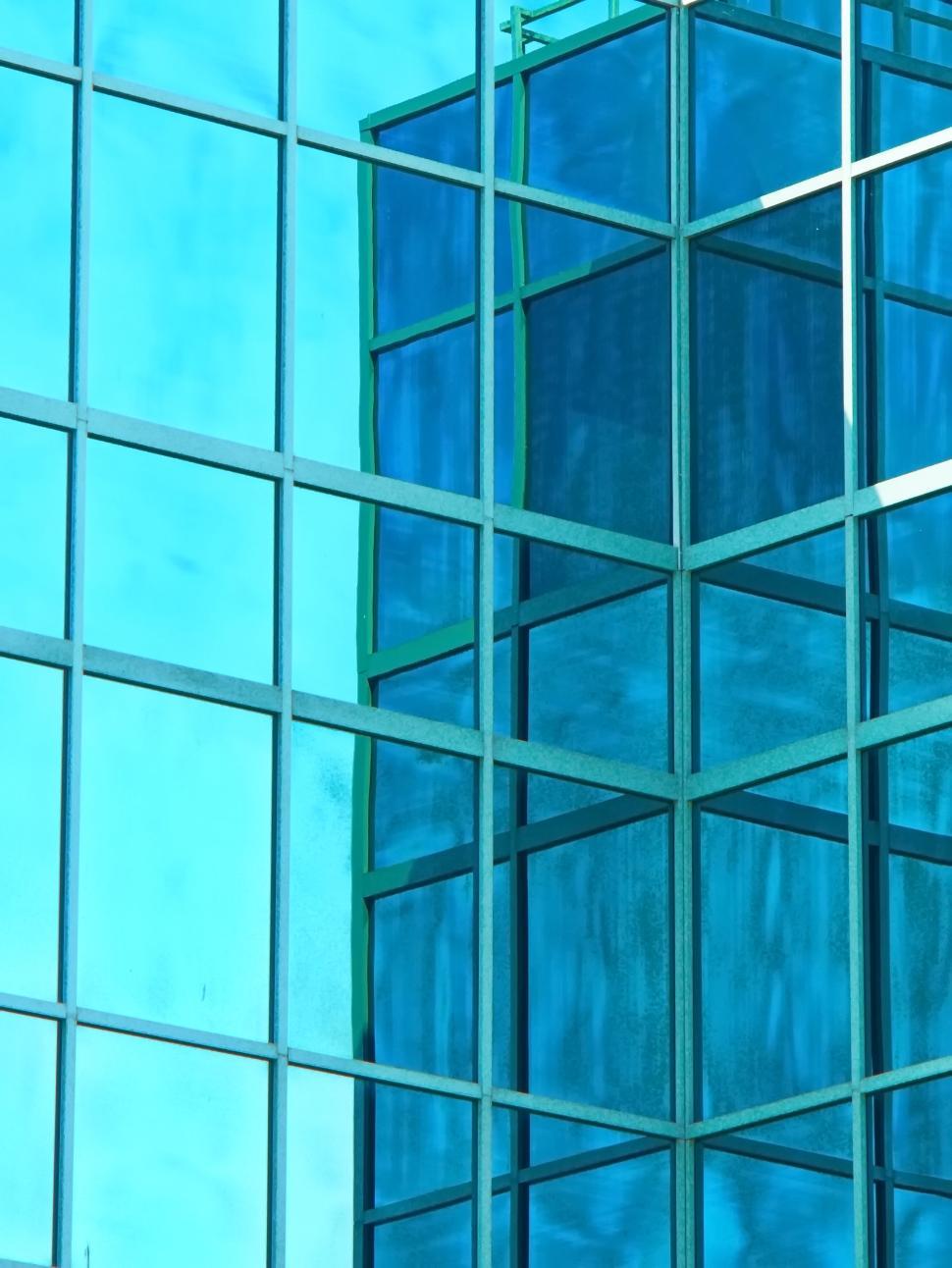 Free Image of Reflection of blue sky in the glass building panels 