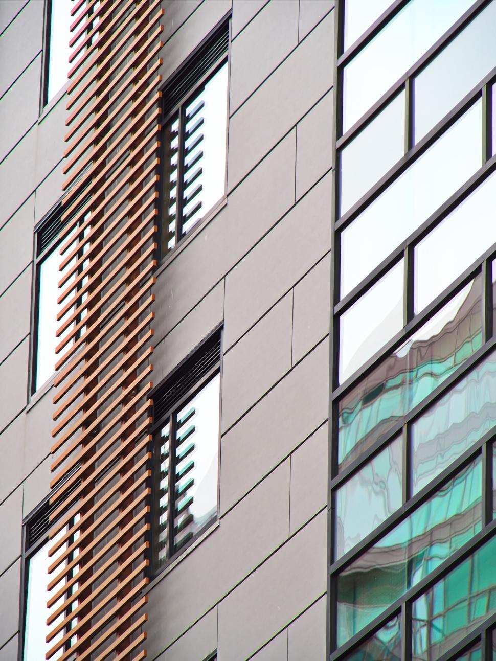 Free Image of Modern building with vertical wooden slats and glass. 