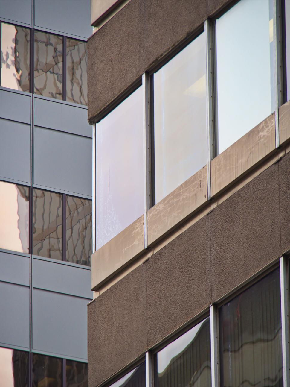 Free Image of Close-up view of modern building with glass reflections 