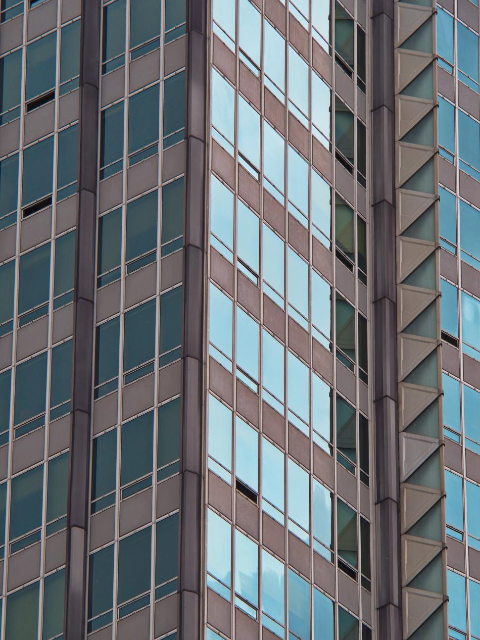 Free Image of Tall Glass Skyscraper Exterior With Reflections 