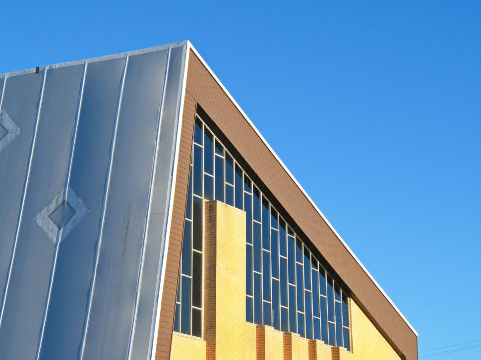 Free Image of Industrial building with geometric patterns and windows 