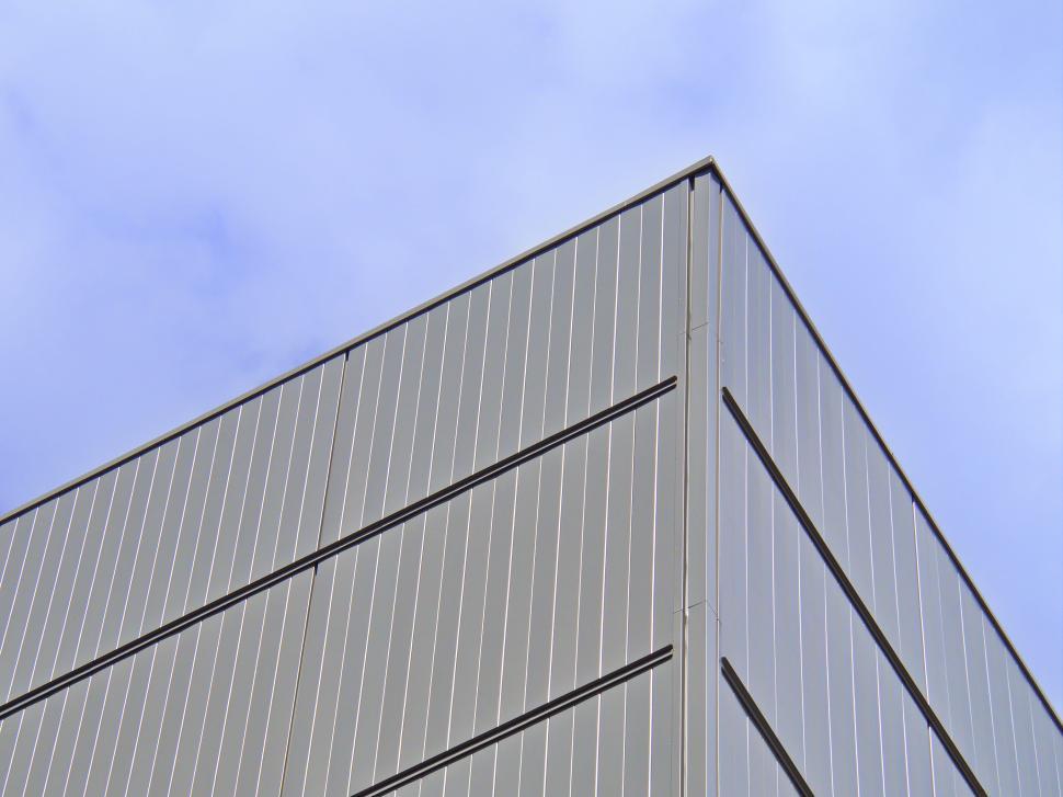 Free Image of Sharp corner of a minimalist industrial building structure. 