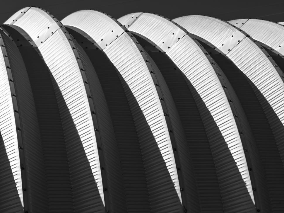 Free Image of Architectural curves of a modern roof structure, black and white. 