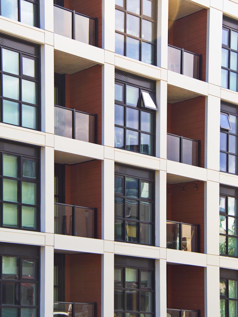 Free Image of Residential building with glass balconies, modern urban living 