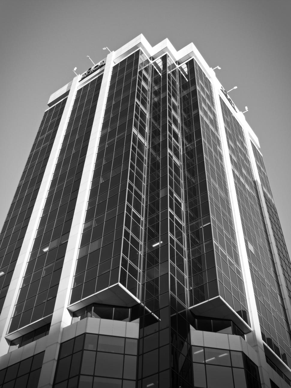Free Image of Tall modern skyscraper with many windows against sky 