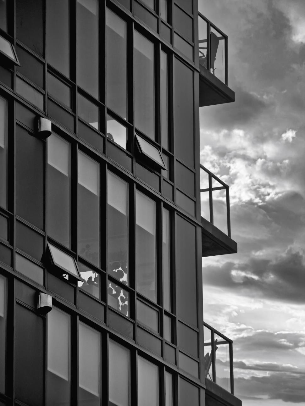 Free Image of Black and white view of a modern glass building 