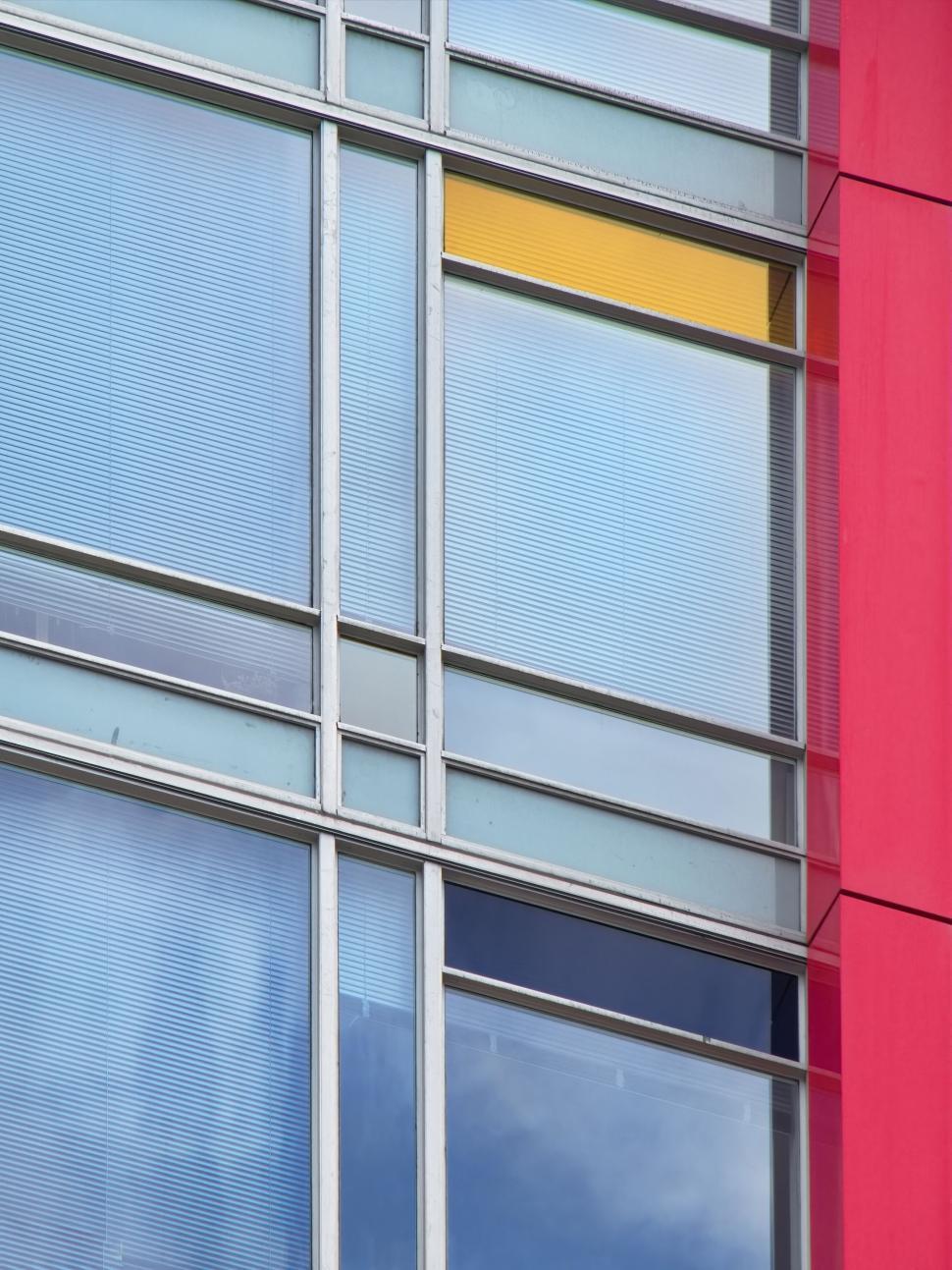 Free Image of Modern office building with reflective glass windows facade. 