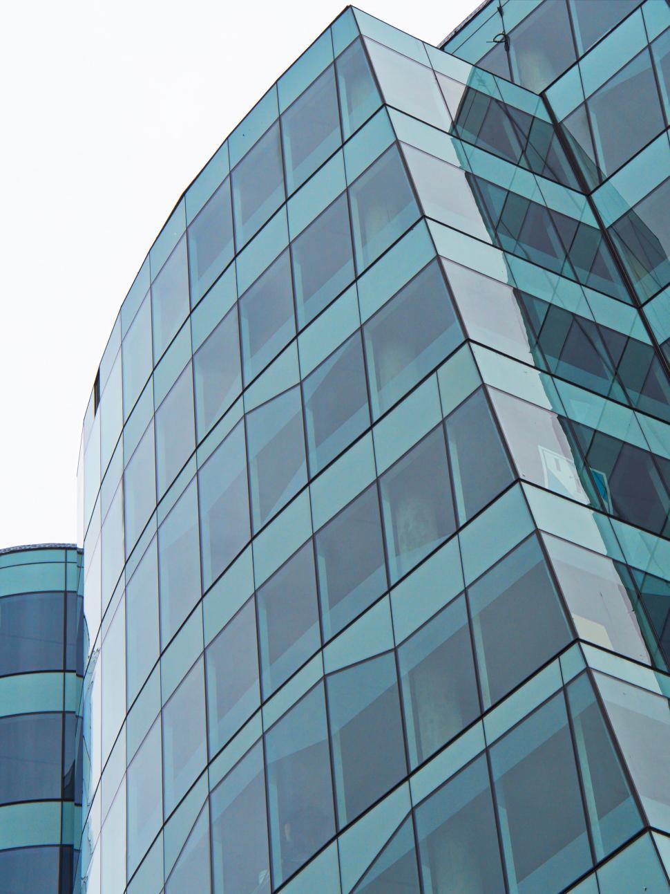 Free Image of Curved glass facade of a contemporary office building. 