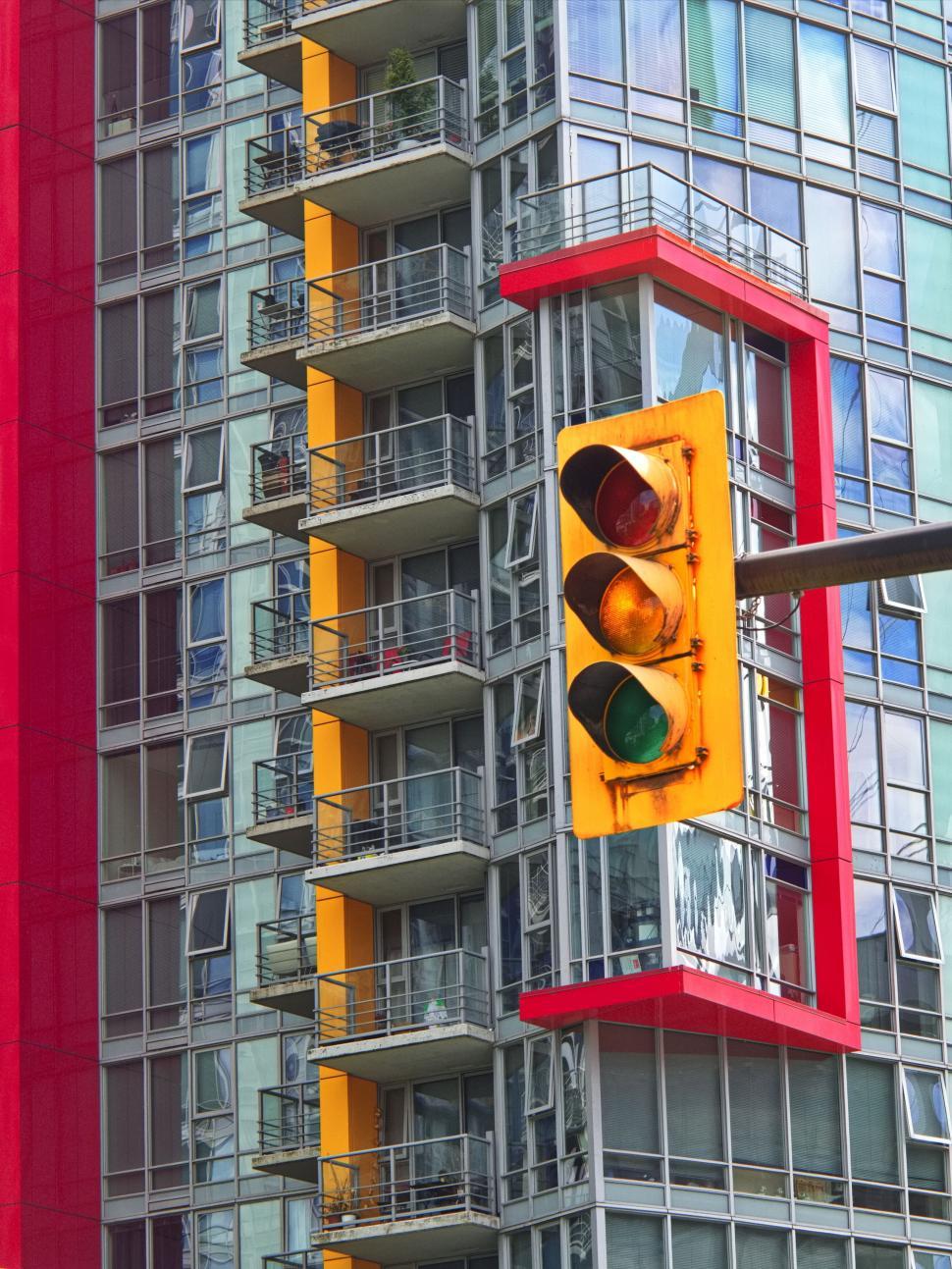 Free Image of Colorful apartment building with bright accents and signal light. 