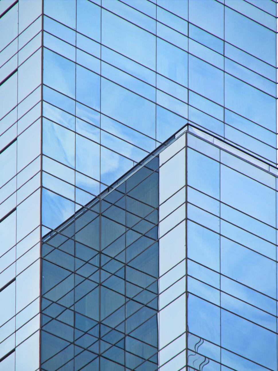 Free Image of Blue Glass Building with Intricate Reflections 