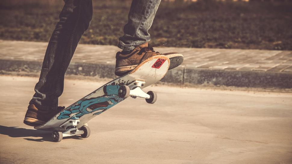 Free Image of Person doing stunt on skateboard in the park 