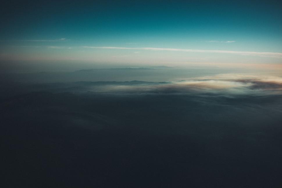 Free Image of Hazy horizon from an airplane view displaying early sky 