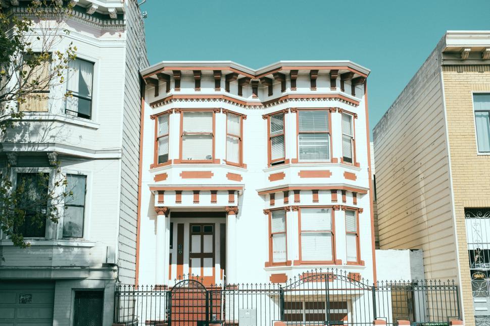 Free Image of Bright and colorful Victorian-style house in daylight 