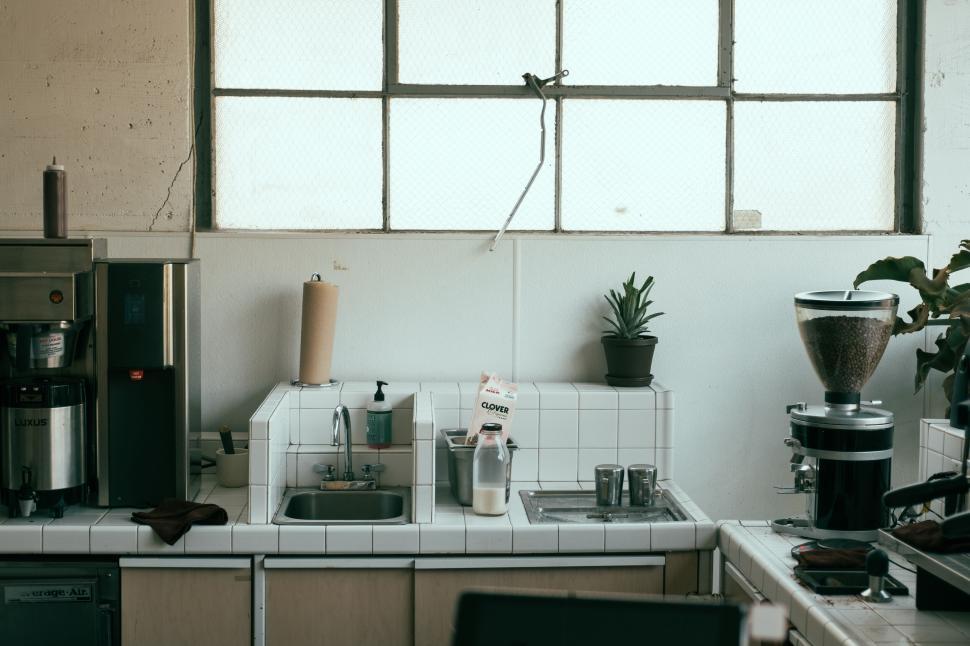 Free Image of Industrial style coffee shop kitchen with equipment. 