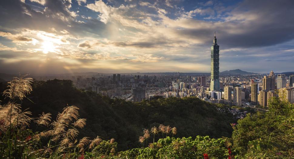 Free Image of Panoramic cityscape view with tall skyscrapers at sunset 