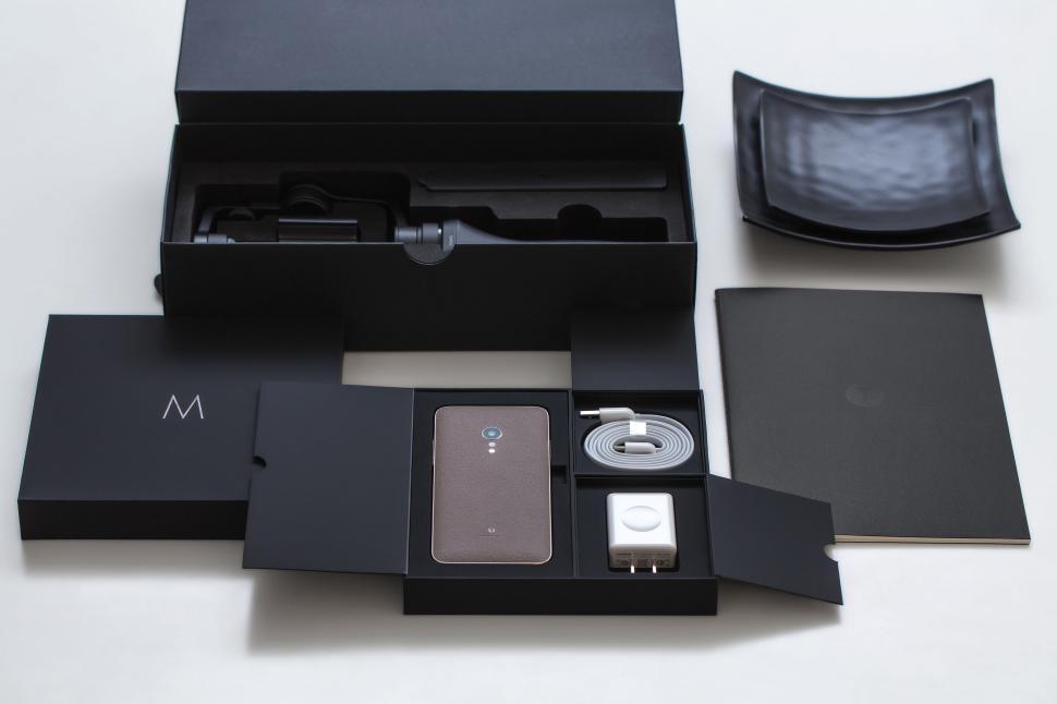 Free Image of Sleek smartphone in stylish packaging with accessories 