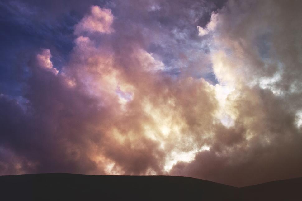 Free Image of Dramatic clouds captured in beautiful evening twilight sky 