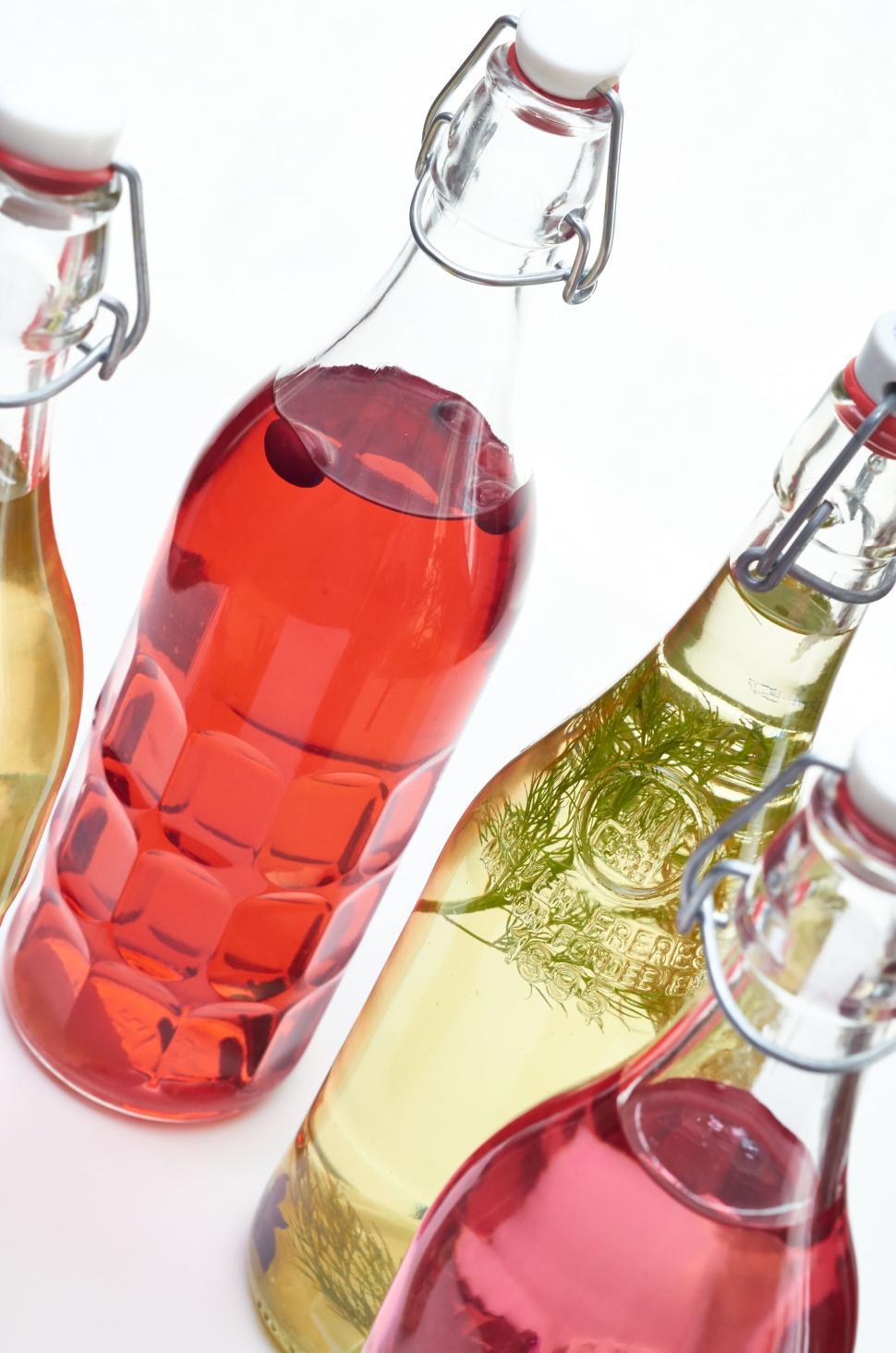 Free Image of Colorful glass bottles with various liquids inside 