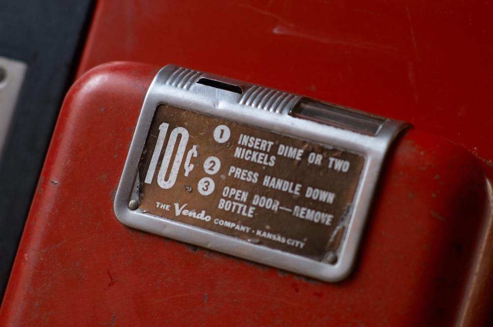 Vintage vending machine with price label for sodas