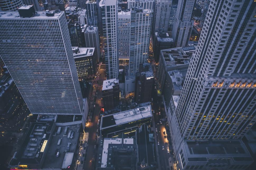 Free Image of Skyscrapers towering over a busy urban downtown area. 