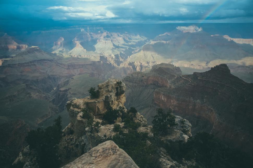 Free Image of Stunning view of the Grand Canyon with a rainbow sky. 