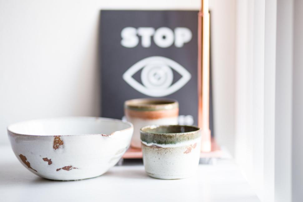 Free Image of Artistic ceramic bowls on a minimalist white surface. 