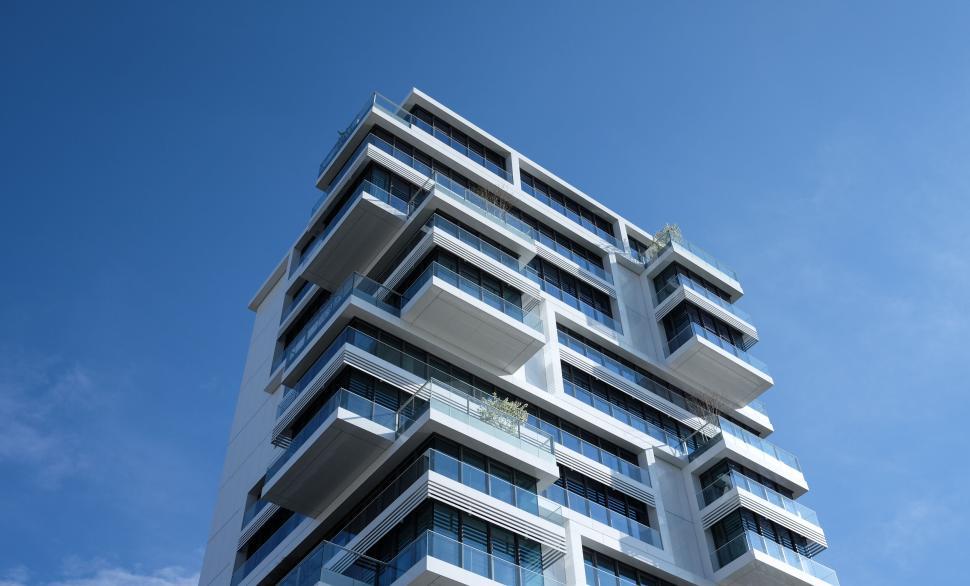 Free Image of Modern architecture with balconies against clear blue sky 