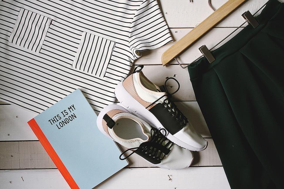Free Image of Organized flat lay of clothing and travel essentials 