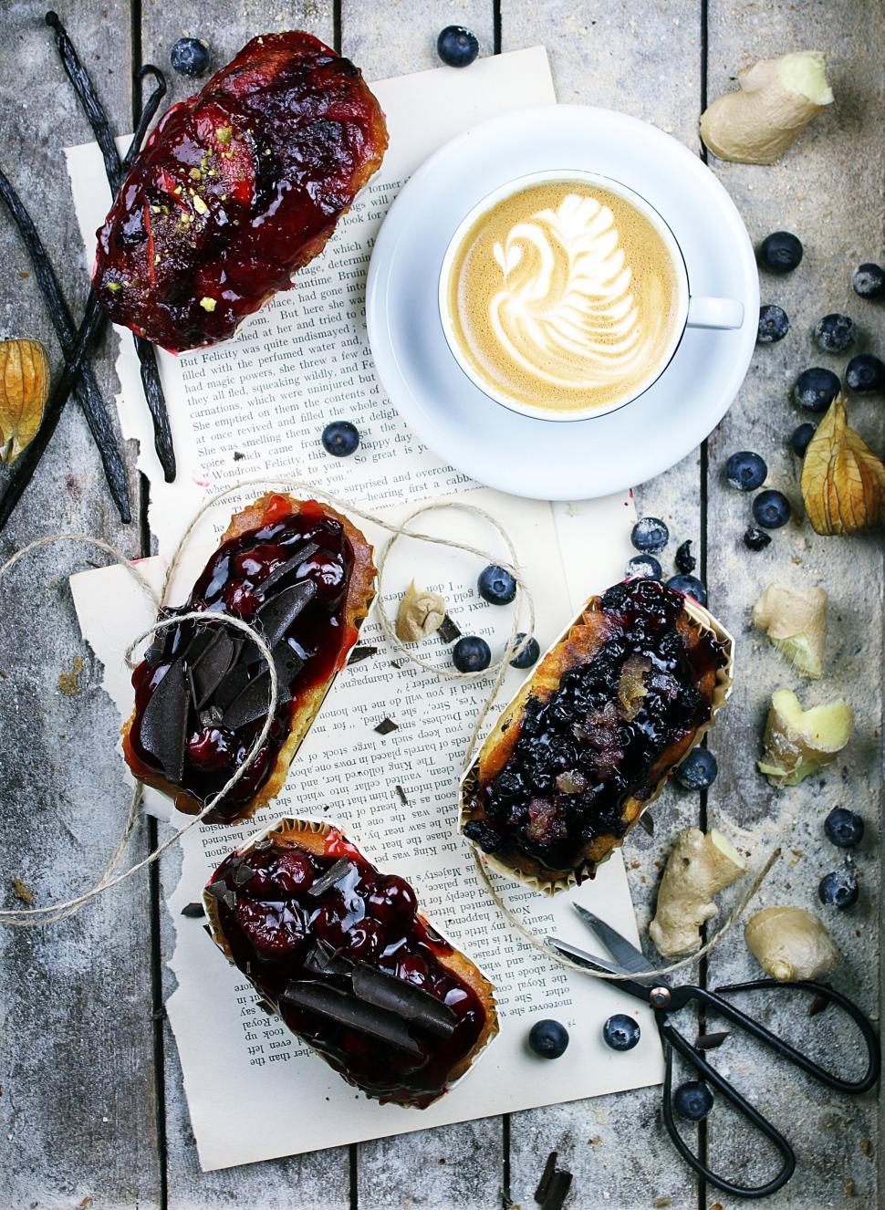 Free Image of Assorted sweet pastries with a cup of latte with art 
