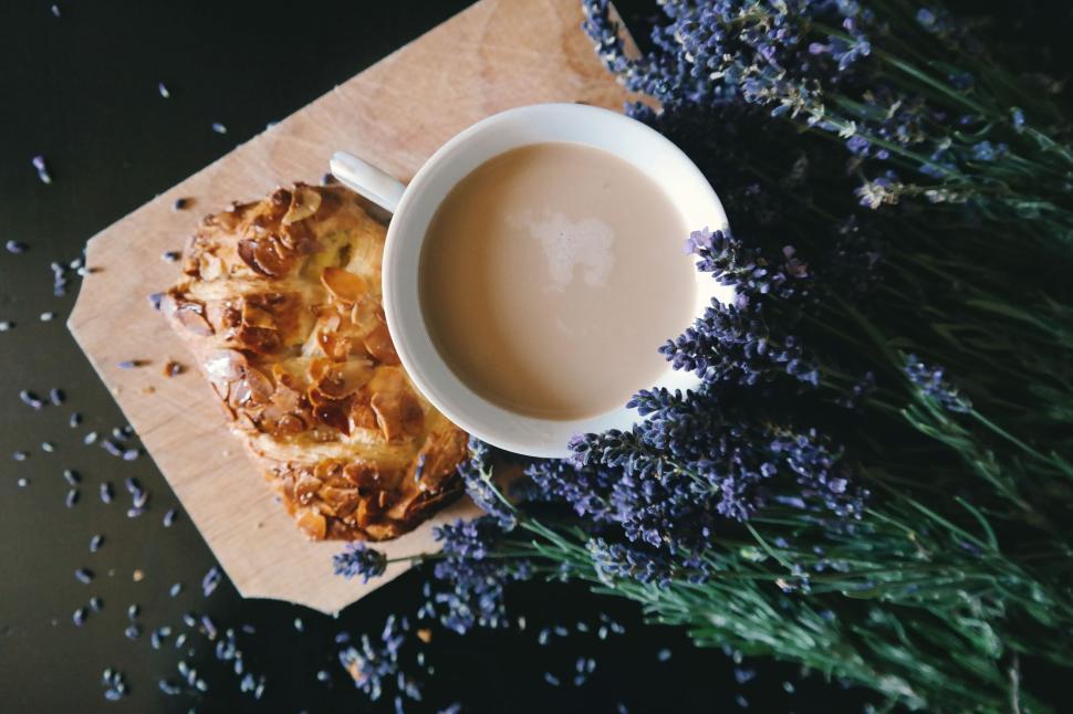 Free Image of Cup of coffee with pastry and lavender flowers 