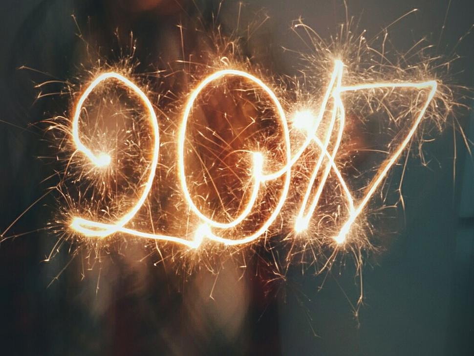 Free Image of Sparkling light trails forming the numbers 2017 