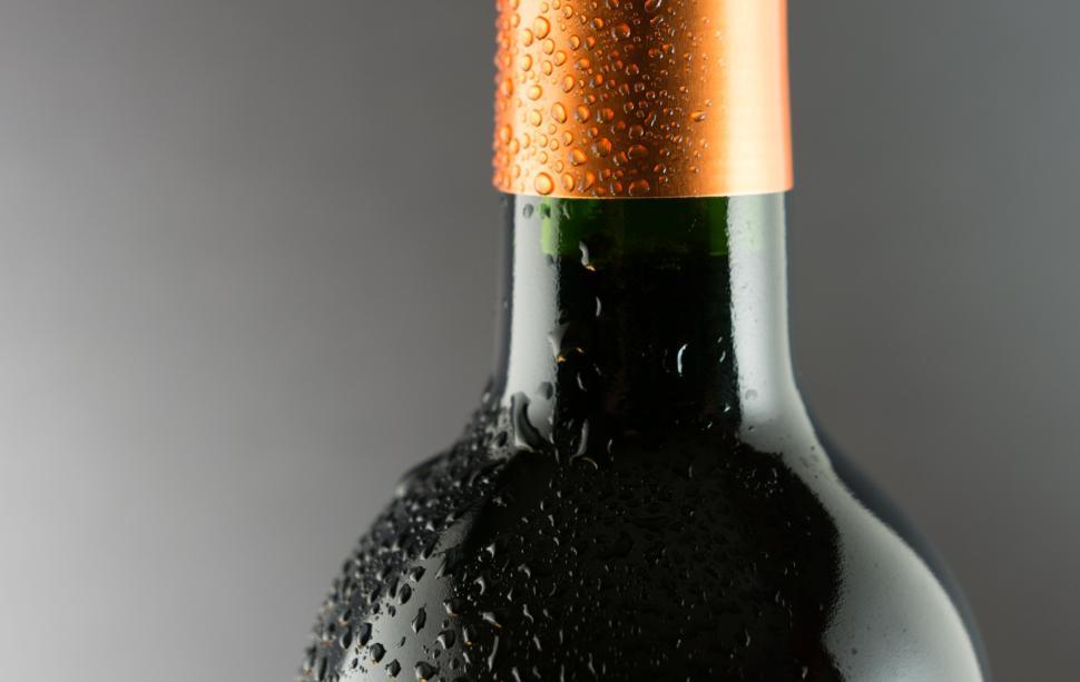 Free Image of Close-up of wine bottle with chilled droplets 