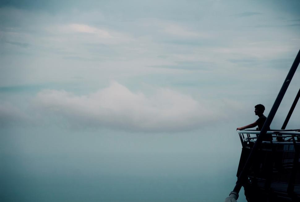 Free Image of Person gazing at horizon from a platform with a view 