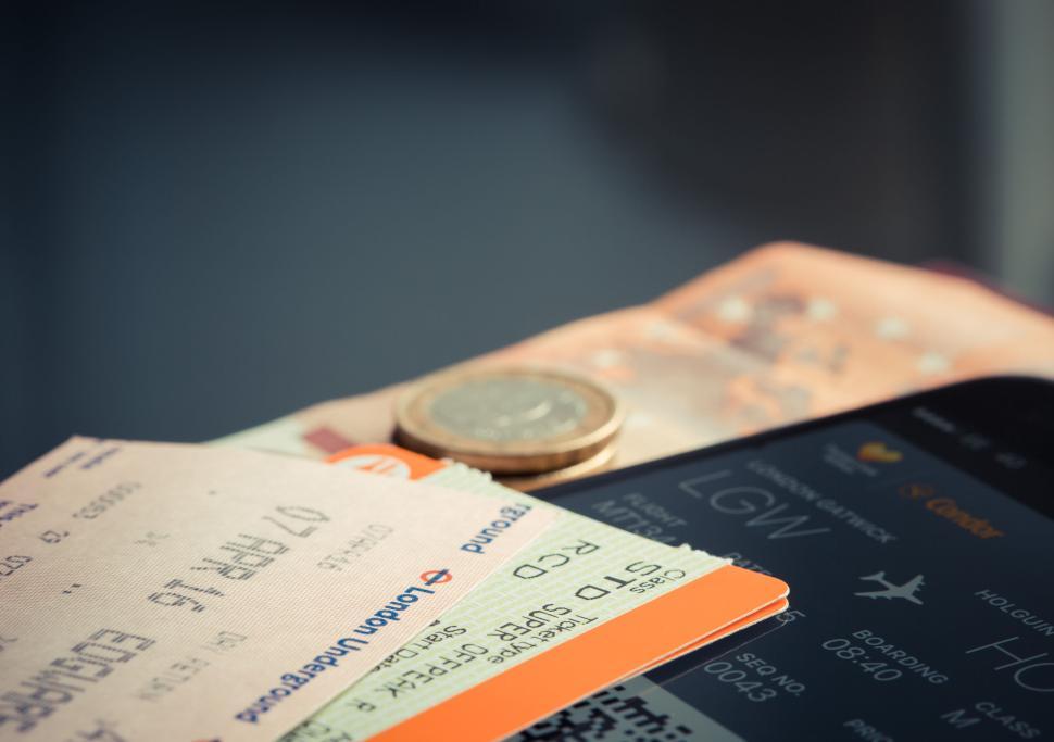 Free Image of Travel essentials with tickets, currency, and boarding pass 