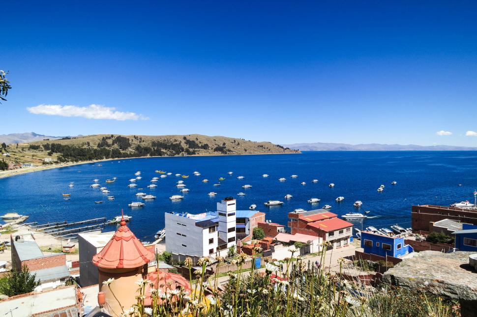 Free Image of Coastal village with colorful buildings and calm blue sea 