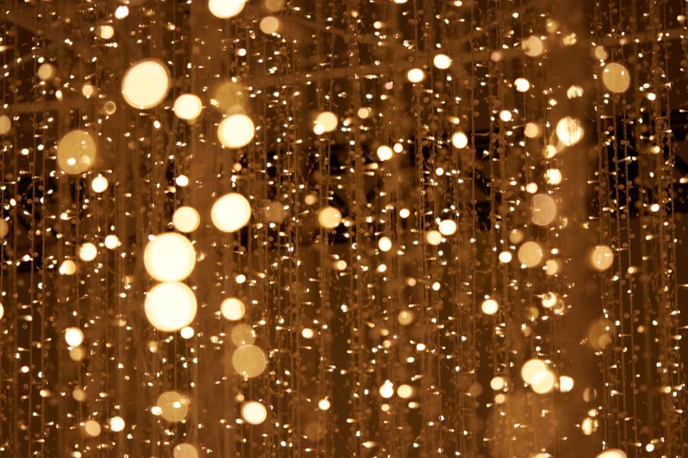Free Image of Golden bokeh lights creating a festive and joyous ambiance 