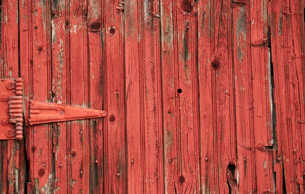 Free Image of Rustic red wooden wall with metal hinge and grain texture 