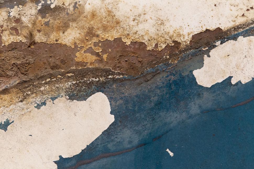 Free Image of Weathered and rusted metal surface with peeling paint 