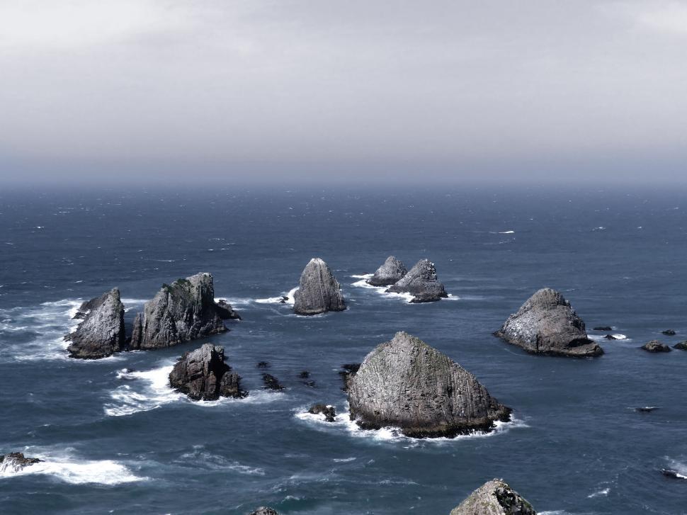 Free Image of Rocky sea stacks emerging from the turbulent ocean. 