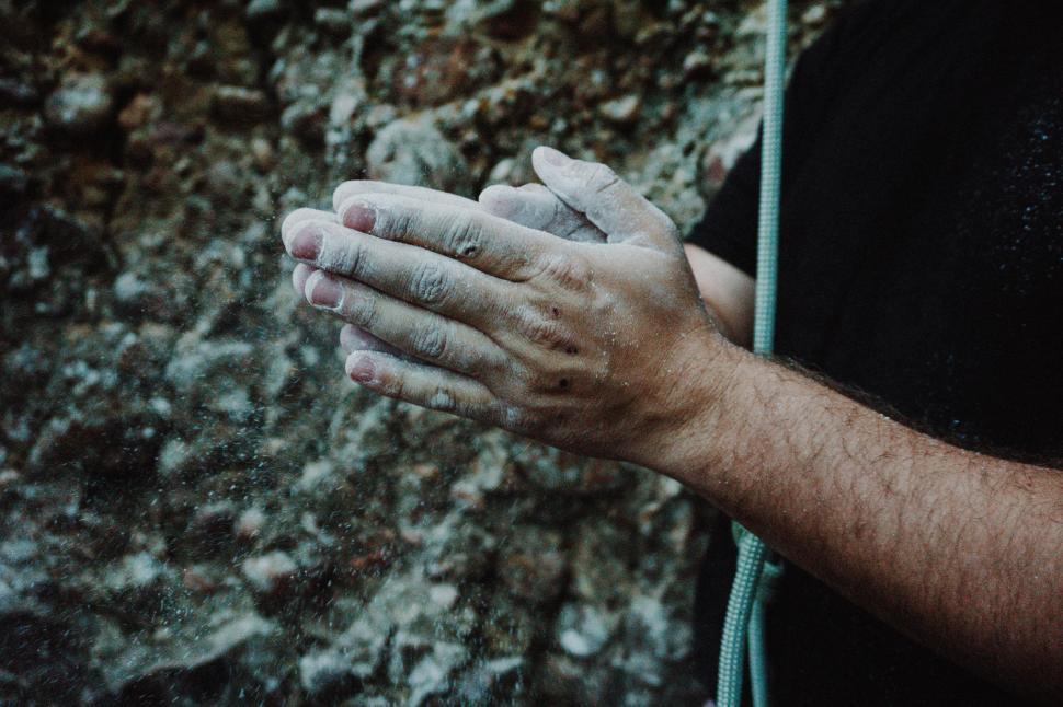 Free Image of Climber s hands covered in chalk, preparing to climb 