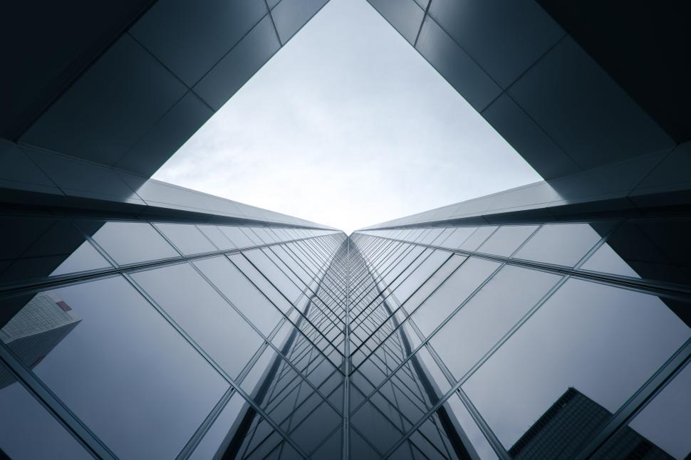 Free Image of Symmetrical skyscraper facade reaching towards the sky. 