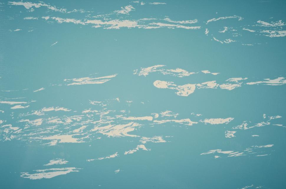 Free Image of Textured light blue background with white brush strokes 