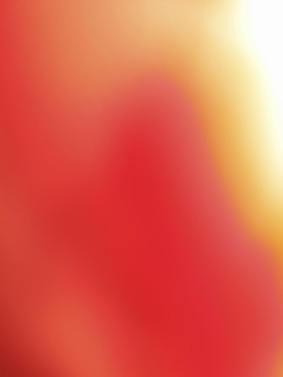 Free Image of Soft focus of blended warm colors, primarily red 
