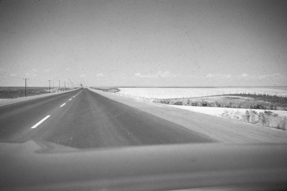 Free Image of Long empty road extending into the distant horizon. 