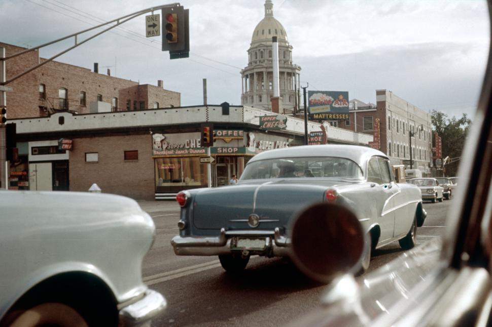 Free Image of Downtown scene with vintage car and state capitol. 