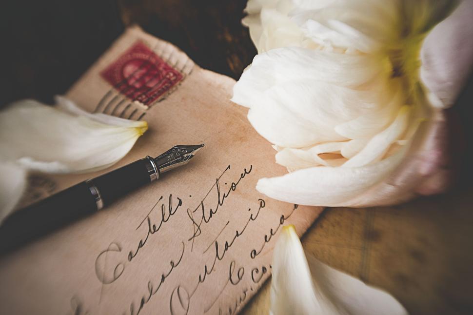 old-handwritten-letter-with-a-fountain-pen-and-petals.jpg