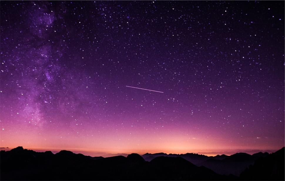 Free Image of Star-filled purple night sky with vibrant Milky Way view 