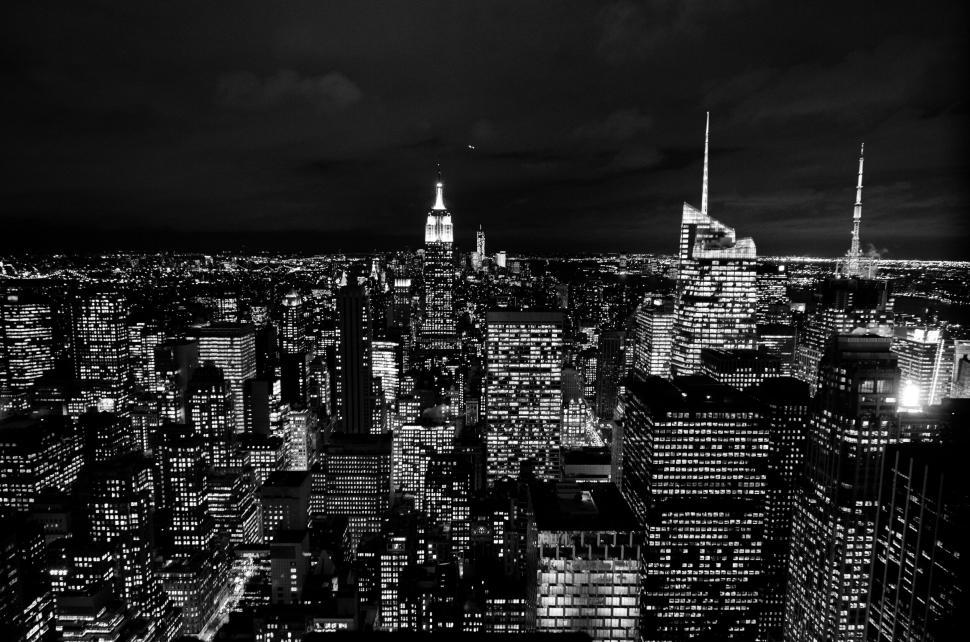 Free Image of Night skyline of a bustling modern city full of lights 