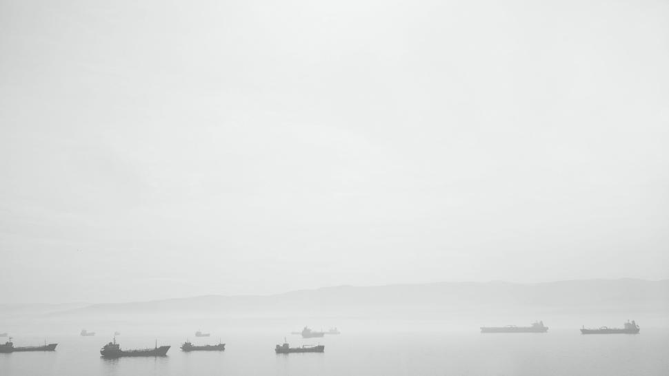 Free Image of Foggy seascape with distant ships and tranquil waters 