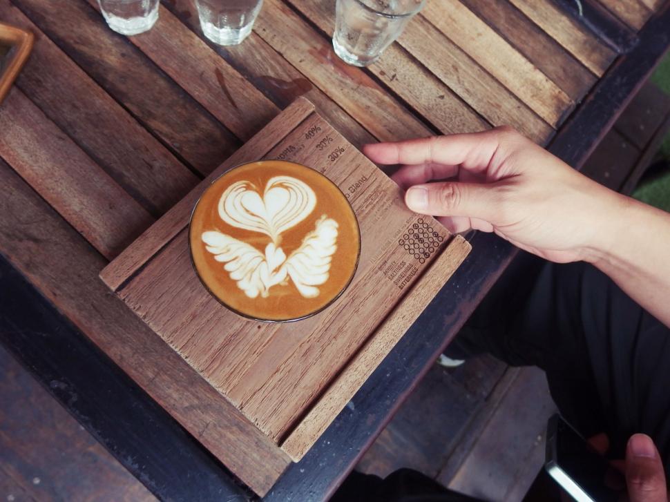 Free Image of Barista s coffee with beautiful heart and wings latte art 